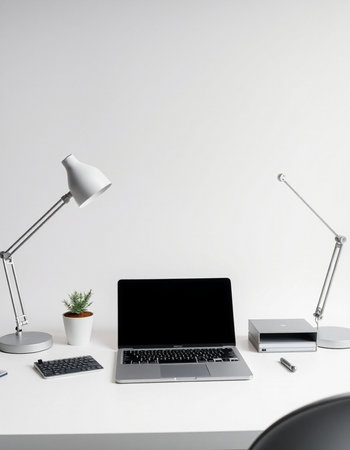 Mockup laptop with blank screen on white office desk with lamp and other supplies