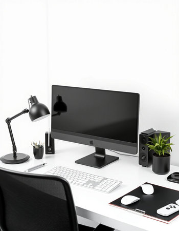 Workplace with computer, lamp and stationery on table in office
