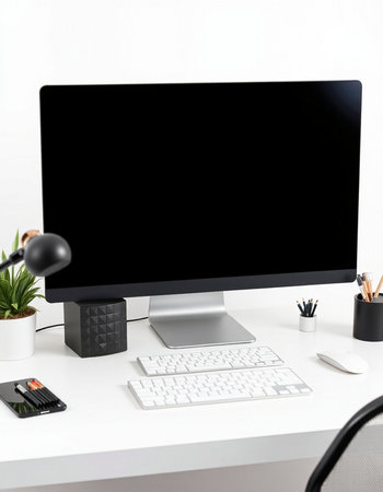 workplace with computer and stationery on the white desk in office