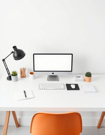 Workplace with computer, lamp and other items on table in officeの写真素材