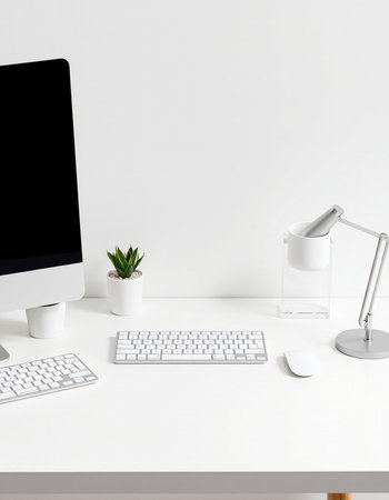 workplace with computer, keyboard, lamp and plant isolated on white
