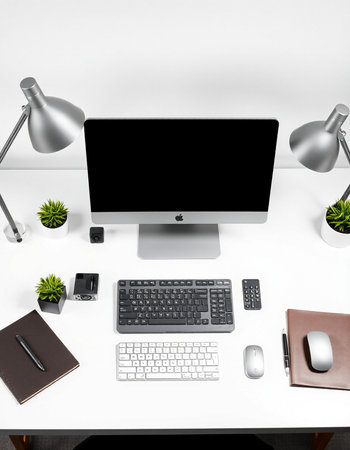 workplace with computer, keyboard, mouse and notebook on white table