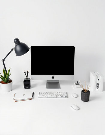 Modern workplace with computer, keyboard, mouse, stationery on white backgroundの写真素材