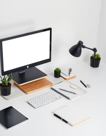 Minimal workspace with computer, stationery and copy space on white table