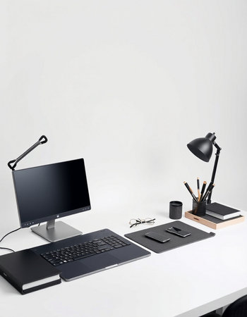 workplace with computer, stationery and lamp on table isolated on white