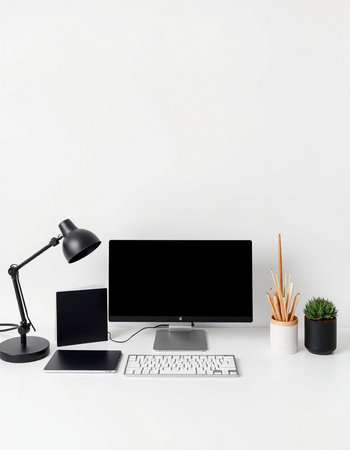 Minimalistic workspace with computer, keyboard, mouse, lamp and coffee cup on white background.