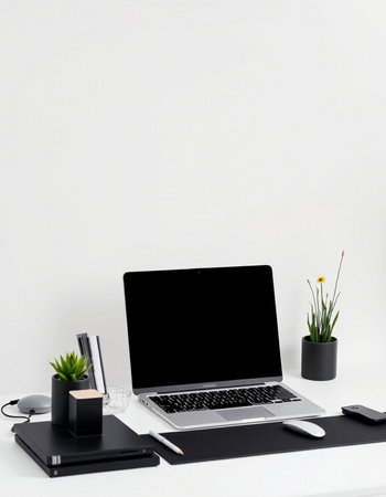 Modern workspace with blank screen laptop computer, coffee cup, supplies and decorations on white...