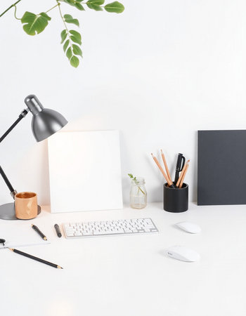 Creative workspace with blank paper, computer keyboard, stationery and plant on white background....