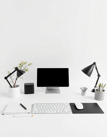 Minimalistic workspace with blank computer screen, keyboard, mouse, coffee cup and other items on...