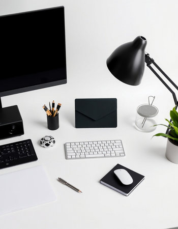 Modern white office desk with computer, mouse, keyboard, notebook, coffee cup, stationery and other...