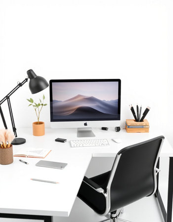 workplace with computer, lamp and stationery isolated on white backgroundの写真素材