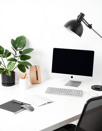 Modern workplace with computer, keyboard, mouse, stationery and plant on white table
