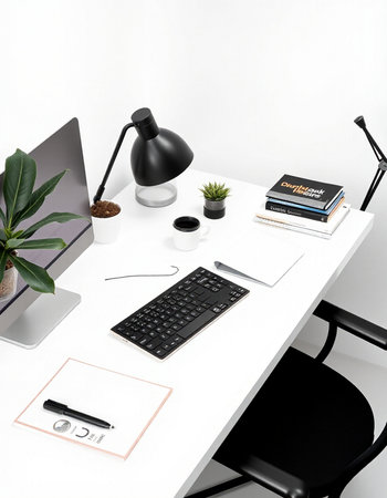 White office desk with black chair, computer, coffee cup, stationery and plant on white background