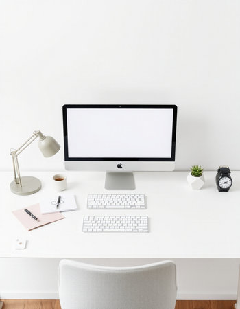 Front view of modern white desktop with blank computer screen, supplies and coffee cup. Mock up