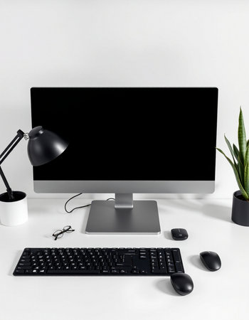 Modern workspace with computer, keyboard, mouse, lamp and plant on white background