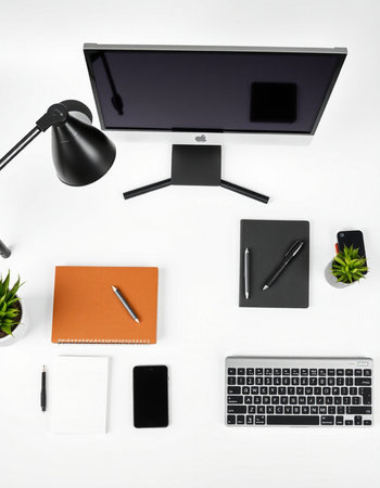 Office desk table with computer, supplies and coffee cup. Top view