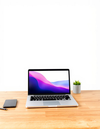 laptop on wood table with white wall and clipping path for background