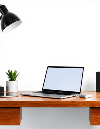 Close up of modern designer desktop with empty white laptop screen, coffee cup and other items. Mock...