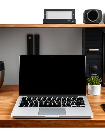 Modern workspace with laptop, coffee cup and photo camera on wooden shelf.