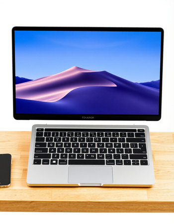 Laptop computer on wooden desk isolated on white background with clipping path