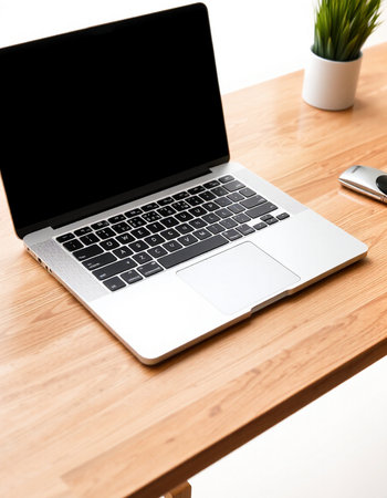Laptop with blank screen on wooden table. Mockup for design