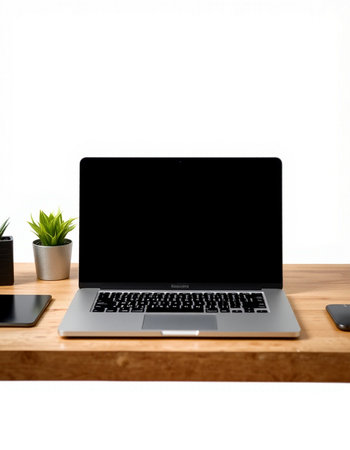 Laptop with blank screen on wood desk isolated on white background.の写真素材