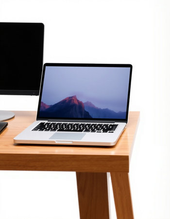 Laptop computer on a table isolated against a white background with clipping path
