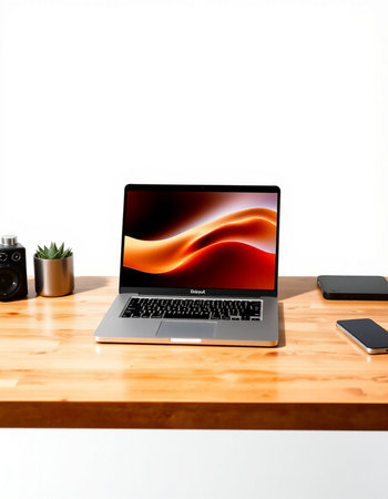 Laptop and smartphone on a wooden table with white wall background.