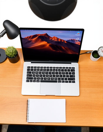 Workplace with laptop and stationery on white background, top view