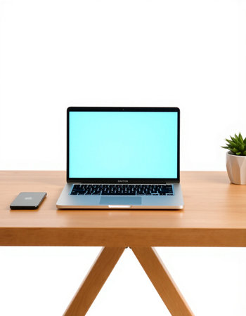 Laptop computer with blank screen on wooden table isolated on white background