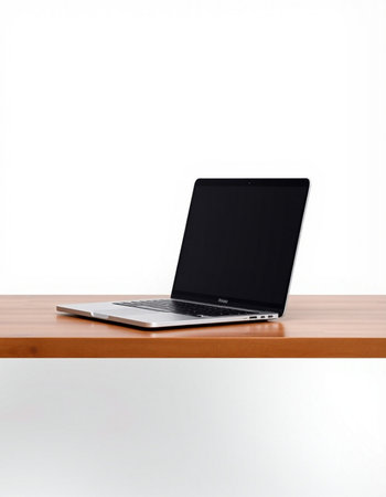 Laptop on a wooden table isolated on a white background with clipping path