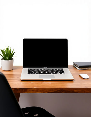Laptop with blank screen on a wooden desk