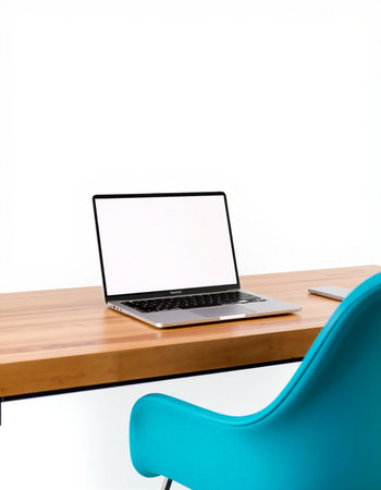 Laptop with blank screen on wooden desk and blue chair on white background