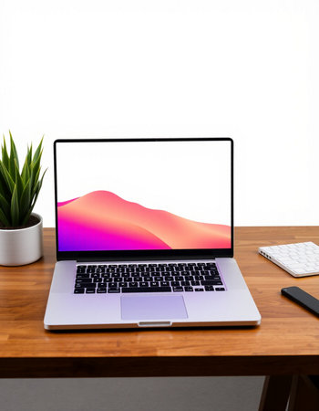 Laptop with blank screen on wooden table in office, stock photo