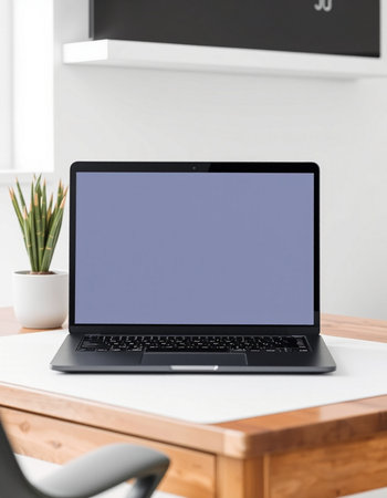 Laptop with blank screen on table in modern office, mockup