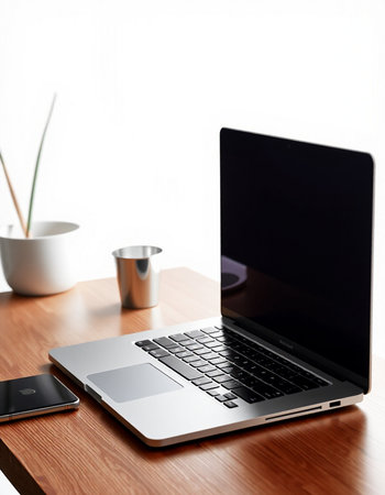 laptop and coffee cup on wooden table with copy space for text
