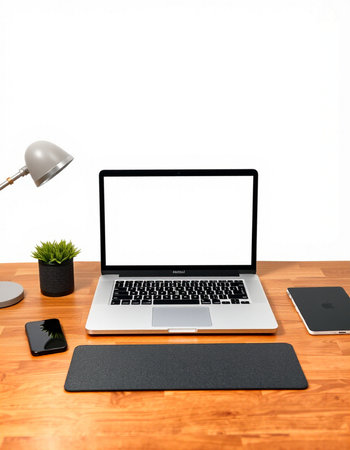 Modern workspace with blank laptop, smartphone, coffee cup and other items on wooden table
