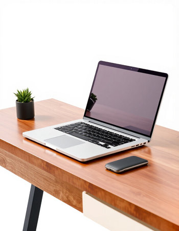 Laptop with blank screen on wooden desk isolated on white background.