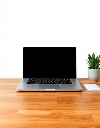 Laptop computer with blank screen on wooden table and white wall background