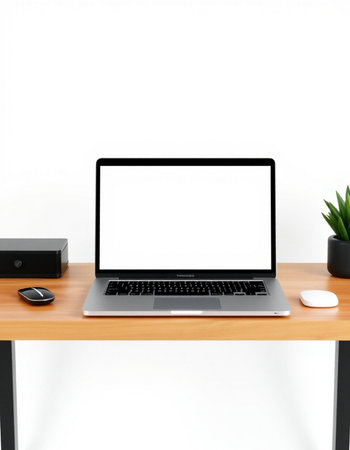 Modern workspace with blank screen laptop computer on wooden desk and office supplies on white wall...