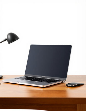 laptop with black screen on wooden table and lamp