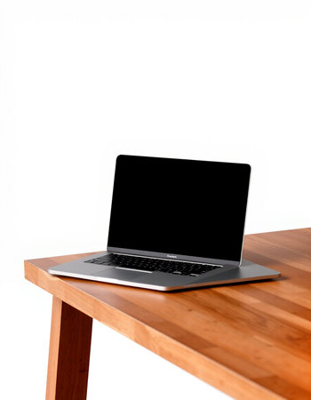 Laptop on wooden table isolated on white background with clipping path.