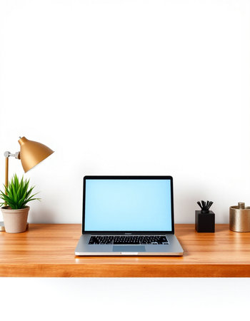 Laptop with blank screen on wooden shelf in front of white wall