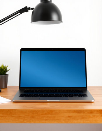 Laptop with blank blue screen on table in office. 3d render