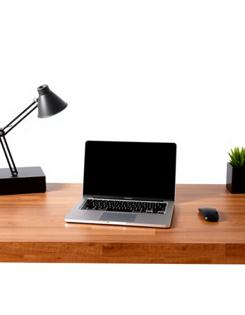 Laptop with blank screen on a wooden desk isolated on white background
