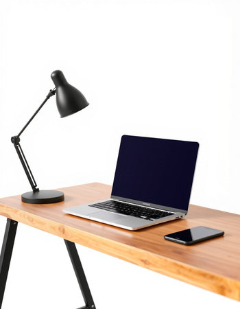 laptop and lamp on the desk isolated on a white background.