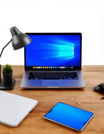 laptop with blue screen on wooden desk, isolated on white background