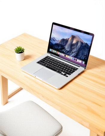 Laptop computer on wooden table isolated on white background with clipping path