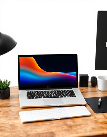 Modern workspace with laptop on wooden table and other objects around, clipping path included