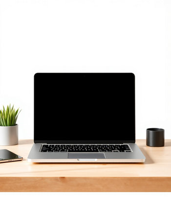 Laptop computer with blank screen on wooden table isolated on white background